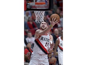 Portland Trail Blazers center Jusuf Nurkic scores during the first half of the team's NBA basketball game against the Chicago Bulls in Portland, Ore., Wednesday, Jan. 9, 2019.