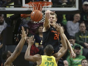 Oregon State's Kylor Kelley, right, blocks a shot by Oregon's Francis Okoro during the second half of an NCAA college basketball game Saturday, Jan. 5, 2019, in Eugene, Ore.