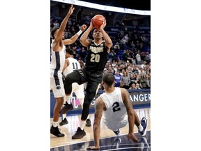 Purdue's Nojel Eastern (20) shoots as Penn State's Myles Dread (2) defends during the first half of an NCAA college basketball game Thursday, Jan. 31, 2019, in State College, Pa.