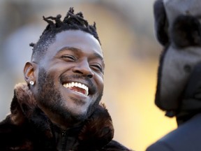 In this photo from Dec. 30, 2018, Pittsburgh Steelers wide receiver Antonio Brown, left, talks to former Steelers quarterback Charlie Batch as he stands on the sideline before an NFL football game against the Cincinnati Bengals, in Pittsburgh. Pittsburgh Steelers head coach Mike Tomlin says he's disappointed in the behavior of star wide receiver Antonio Brown but added the team has not received any formal trade request from Brown's camp.