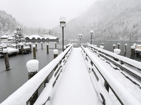 A pier is snow covered after heavy snow falls during the night at the Koenigssee lake in Berchtesgaden, southern Germany, Saturday, Jan.5, 2019.