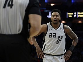 San Antonio Spurs' Rudy Gay, right, reacts to a call by referee Curtis Blair during the first half of an NBA basketball game against the Philadelphia 76ers, Wednesday, Jan. 23, 2019, in Philadelphia.