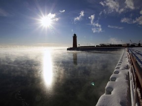 Steam rises from Lake Michigan on Friday morning, Jan. 25, 2019, in Milwaukee. An arctic wave has wrapped parts of the Midwest in numbing cold, sending temperatures plunging and prompting officials to close dozens of schools Friday, but forecasters say the worst may be yet to come.