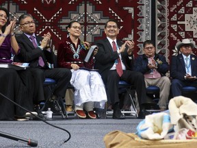 From left, Dottie Lizer, Navajo Nation Vice President Myron Lizer, first lady Phefelia Herbert Nez and Navajo President Jonathan Nez sit onstage during the tribal inauguration Tuesday, Jan. 15, 2019, in Fort Defiance, Ariz.