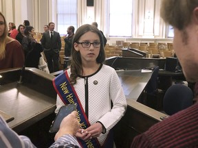 Lola Giannelli, New Hampshire's first "Kid Governor" answers questions at a news conference after her inauguration Friday, Jan. 18, 2019, at the Statehouse in Concord, N.H. The fifth-grader from Nashua was elected as part of civics program created by the Connecticut Democracy Center.