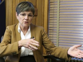 FILE - In this Dec. 17, 2018, file photo, Kansas Gov.-elect Laura Kelly answers questions during an interview with The Associated Press at the Statehouse in Topeka, Kan. Kelly was scheduled to be sworn as the state's 48th governor Monday, Jan . 14, 2019, with her inaugural address likely to stress the broad themes that underpinned her successful campaign last year.