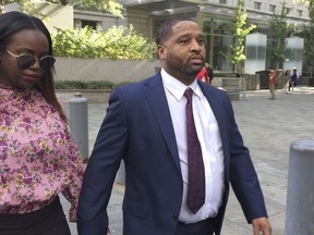 FILE - In this Oct. 10, 2017, file photo, University of Arizona assistant men's basketball coach Emanuel Richardson leaves Manhattan federal court in New York. Richardson, no longer with the team, is expected in federal court, Tuesday, Jan. 22, 2019, for a development in a criminal case in which he is charged with taking bribes from a sports agent.