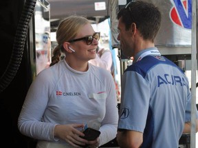 Christina Nielsen of Denmark chats with a crew member during a test session at Daytona International Speedway in Daytona Beach, Fla., Friday, Jan. 4, 2019. Nielsen is part of an all-female-driver team racing in the Rolex 24 at Daytona later this month.