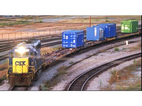 FILE - In this Sept. 29, 1994 file photo, a CSX Train with spent nuclear fuel passes through Florence, S.C., on its way to Savannah River Site Weapons Complex near Aiken S.C. Nevada and South Carolina are jostling for a home-field advantage of sorts in a federal court battle that could result in a metric ton of weapons-grade plutonium being stored 70 miles from Las Vegas.