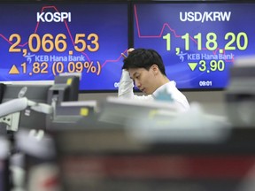 A currency trader watches monitors at the foreign exchange dealing room of the KEB Hana Bank headquarters in Seoul, South Korea, Thursday, Jan. 10, 2019. Asian markets were mostly lower Thursday as U.S. and Chinese officials wrapped up three days of talks in Beijing without significant breakthroughs.