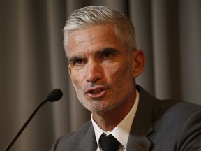 Former Australian soccer national team member Craig Foster talks to journalists at The Foreign Correspondents' Club of Thailand after meeting with detained refugee Hakeem al-Araibi in Bangkok, Thailand, Friday, Jan. 25, 2019. FIFA has written to the Thai prime minister calling for the release of a Bahraini refugee soccer player who is in detention while embroiled in an extradition case.