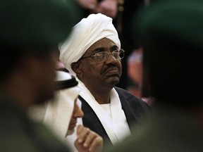 FILE - In this Oct. 25, 2011 file photo, Sudanese President Omar al-Bashir attends the funeral of Saudi Crown Prince Sultan bin Abdul-Aziz Al Saud, in Riyadh, Saudi Arabia. Sudan's embattled president has flown to Qatar, the tiny but wealthy Gulf state that has offered him help as he faces protests initially sparked by the country's economic woes but which soon shifted to calling on him to step down. Qatar's official news agency said al-Bashir, in power since 1989, will meet Wednesday with the emirate's ruler, Sheikh Tamim bin Hamad Al Thani.