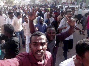 FILE - In this Dec. 20, 2018 file handout photo, provided by a Sudanese activist, protesters chant slogans during a demonstration, in Khartoum, Sudan. Sudanese President Omar al-Bashir is facing a tough challenge to his grip on power. He rules what was once Africa's largest country, one that was prominent on the world stage in the 1990s and 2000s for all the wrong reasons -- civil war, suspected genocide, links to Islamic militants. Days of protests against al-Bashir's government may bring it back into the spotlight.