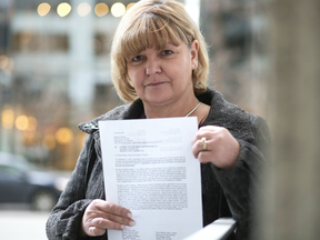 Sheila Griffith, who runs a ranching operation with her husband, holds her letter to Rachel Notley and Justin Trudeau outside her office in Calgary, on Jan. 2, 2019.