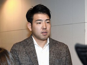 In this Dec. 16, 2018, photo, Japanese baseball player Yusei Kikuchi speaks to journalists before he leaves for the United States, at Narita international airport in Narita, near Tokyo. The Seattle Mariners have signed Kikuchi to a four-year deal on Wednesday, Jan. 2, 2019 after word first surfaced of an agreement late on New Year's Eve. Kikuchi was one of the few starter options remaining on the market and will be joining a team with a long history of success with Japanese players. (Kyodo News via AP)