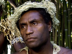 FILE - This Sept. 9, 2015, file photo shows Mungau Dain in Venice, Italy. Dain had never considered acting before he starred in the Oscar-nominated film "Tanna." He got the role because his elders decided he was the best-looking guy in their traditional village on the Pacific nation of Vanuatu. Dain died Saturday, Jan. 5, 2019,  in the capital Port Vila, after contracting a leg infection that wasn't quickly treated. He was in his mid-20s.