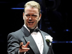 In this May 14, 2009, photo, Craig McLachlan, playing the role of Billy Flynn, performs a number in the latest production of the musical Chicago in Sydney. Australian actor McLachlan has been charged with eight counts of indecent assault, and one count of common assault, after being accused of sexual misconduct by three women who worked with him in a stage musical.