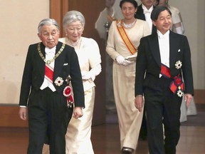 Japanese Emperor Akihito, left, and Empress Michiko, second from left, Crown Prince Naruhito, right, and Crown Princess Masako, second from right, arrive for an imperial ceremony in the celebration of New Year at the Imperial Palace in Tokyo, Tuesday. Jan. 1, 2019. (Kyodo News via AP)