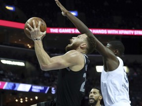 Detroit Pistons Blake Griffin (23) goes up for a basket while guarded by Memphis Grizzlies Jaren Jackson Jr. (13) in the first half of an NBA basketball game Wednesday, Jan. 2, 2019, in Memphis, Tenn.