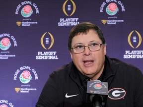 FILE - In this Jan. 1, 2018, file photo, Georgia offensive coordinator Jim Chaney talks to reporters during a news conference in Los Angeles. Chaney is returning to Tennessee for a second stint as the Volunteers' offensive coordinator after spending the last three seasons at Georgia.