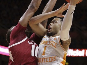 Tennessee guard Lamonte Turner (1) attempts a shot over Arkansas forward Daniel Gafford (10) in the first half of an NCAA college basketball game, Tuesday, Jan. 15, 2019, in Knoxville, Tenn.