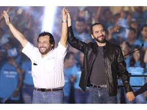 The presidential candidate for the Gran Alianza por la Unidad Nacional, GANA, Nayib Bukele, right, along with his running mate Felix Ulloa, raise their arms during a rally at the Plaza Gerardo Barrios, in San Salvador, El Salvador, on Saturday Jan. 26, 2019. Bukele leads in the polls as Salvadorans get ready to go to vote on Feb. 3.
