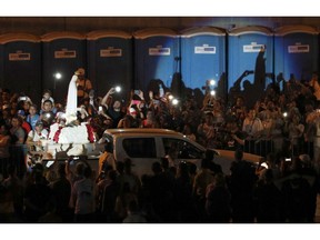 An image of the Virgin Mary is carried on the bed of a pick-up truck during a vigil with Pope Francis at Campo San Juan Pablo II in Panama City, Saturday, Jan. 26, 2019.