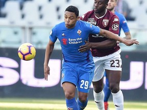 Torino's Soualiho Meite and Fiorentina's Luis Muriel, left, vie for the ball during the second round of the Italian Cup soccer match between Torino and Fiorentina at the Olympic stadium in Turin, Italy, Sunday,  Jan. 13, 2019.