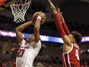 Texas Tech's Jarrett Culver (23) shoots in front of Oklahoma's Jamuni McNeace (4) during the first half of an NCAA college basketball game Tuesday, Jan. 8, 2019, in Lubbock, Texas.