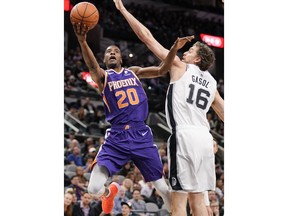 Phoenix Suns' Josh Jackson (20) shoots against San Antonio Spurs' Pau Gasol during the first half of an NBA basketball game, Tuesday, Jan. 29, 2019, in San Antonio.