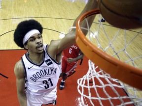 Brooklyn Nets' Jarrett Allen (31) dunks the ball against the Houston Rockets during the first half of an NBA basketball game Wednesday, Jan. 16, 2019, in Houston.