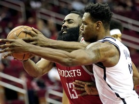 Houston Rockets' James Harden (13) is fouled by Brooklyn Nets' Treveon Graham during the first half of an NBA basketball game Wednesday, Jan. 16, 2019, in Houston.