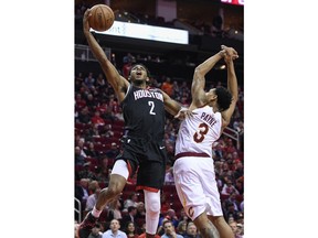 Houston Rockets guard Brandon Knight (2) drives to the basket past Cleveland Cavaliers guard Cameron Payne during the first half of an NBA basketball game Friday, Jan. 11, 2019, in Houston.