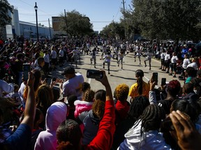 In this Monday, Jan. 15, 2018 photo, the Isiserettes perform during a break in the MLK Grande Parade in Houston. For more than two decades, competing MLK Day parades have been held in Houston. This year, the city of Houston threw its official support behind one parade, the 41st annual "Original" MLK, Jr. Parade, hoping the city could unite behind only one parade. But organizers of the other parade, the 25th annual MLK Grande Parade, will still be holding its event and they say they have no plans to stop having their own parade.
