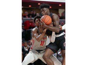 Houston guard Nate Hinton (11) collides with Temple forward De'Vondre Perry (22) as he attempts a steal during the first half of an NCAA college basketball game Thursday, Jan. 31, 2019, in Houston.