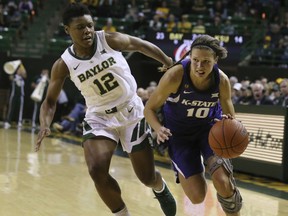 Kansas State guard Kayla Goth, right, drives past Baylor guard Moon Ursin during the first half of an NCAA college basketball game Wednesday, Jan. 9, 2019, in Waco, Texas.