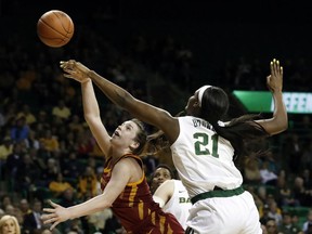 Iowa State guard Bridget Carleton, left, attempts a shot as Baylor center Kalani Brown (21) defends in the first half of an NCAA college basketball game in Waco, Texas, Wednesday, Jan. 23, 2019.