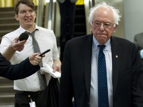 Sen. Bernie Sanders heads to his office at the Capitol in Washington, Friday, Dec. 21, 2018.