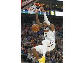 Denver Nuggets forward Torrey Craig (3) dunks the ball against the Utah Jazz during the first half in an NBA basketball game, Wednesday, Jan. 23, 2019, in Salt Lake City.