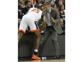 Virginia head coach Tony Bennett instructs Virginia forward Mamadi Diakite (25) during the first half of an NCAA college basketball game against Virginia Tech, in Charlottesville, Va., Tuesday, Jan. 15, 2019.