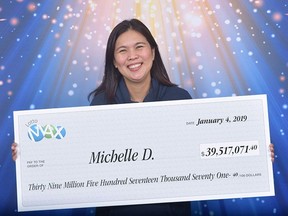 Michelle De Roma from Surrey, B.C. claims her Lotto Max prize of $39.5 million in Vancouver, Friday, Jan.4, 2019. THE CANADIAN PRESS/HO-British Columbia Lottery Corporation MANDATORY CREDIT