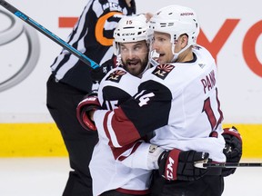 Arizona Coyotes' Brad Richardson, left, and Richard Panik, of Slovakia, celebrate Panik's goal against the Vancouver Canucks during the second period of an NHL hockey game in Vancouver, on Thursday January 10, 2019.