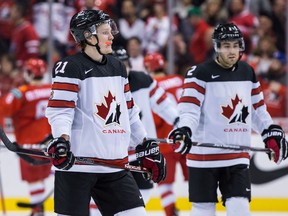 Canada's Owen Tippett, front left, and Evan Bouchard skate to the blue line after losing to Russia during IIHF world junior hockey championship action in Vancouver on Monday, Dec. 31, 2018.