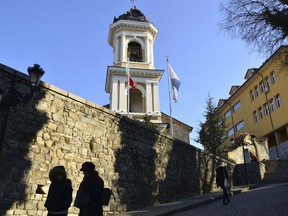 People are silhouetted as they walk in the old town of Plovdiv, ahead of the opening ceremony of Plovdiv as the European Capital of Culture, in Bulgaria, Saturday, Jan. 12, 2019. Plovdiv is the first Bulgarian town named to celebrate the most prestigious cultural initiative of the European Union, along with the Italian city of Matera as the twin European Capital of Culture for 2019. (AP Photo)