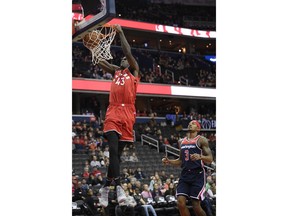 Toronto Raptors forward Pascal Siakam (43) dunks past Washington Wizards guard Bradley Beal (3) during the first half of an NBA basketball game, Sunday, Jan. 13, 2019, in Washington.