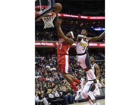 Washington Wizards guard Bradley Beal (3) goes to the basket past Indiana Pacers guard Edmond Sumner (5) during the first half of an NBA basketball game, Wednesday, Jan. 30, 2019, in Washington.