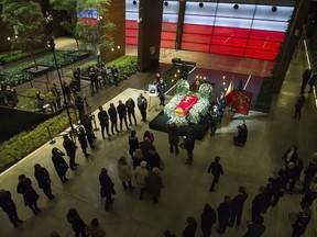Mayor Pawel Adamowicz's coffin lies in state in the European Solidarity Centre in Gdansk, Poland, Thursday, Jan. 17, 2019. Residents of a Polish city are paying respects at the coffin of the longtime mayor who was killed in a stabbing attack. Gdansk Mayor Pawel Adamowicz will lie in state until Friday at a museum is devoted to the history of Poland's anti-communist Solidarity movement, which started in the city.