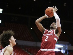 Stanford guard Bryce Wills (2) shoots in front of Washington State forward CJ Elleby during the first half of an NCAA college basketball game in Pullman, Wash., Saturday, Jan. 19, 2019.