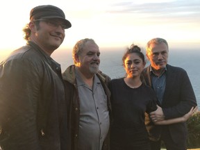 In this photo taken on Jan. 9, 2019, from left, director Robert Rodriguez, producer Jon Landau, actors Rosa Salazar and Christoph Waltz pose for a photo near Wellington, New Zealand. The movie "Alita: Battle Angel" has been 20 years in the making, and producer Jon Landau is confident it will finally signal a success for Hollywood in a genre which has proved problematic.