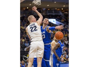 Seton Hall forward Sandro Mamukelashvili, right, defends against Marquette's Joey Hauser, left, during the first half of an NCAA college basketball game Saturday, Jan. 12, 2019, in Milwaukee.